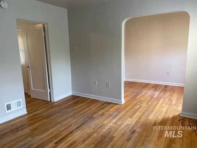 unfurnished room featuring wood-type flooring