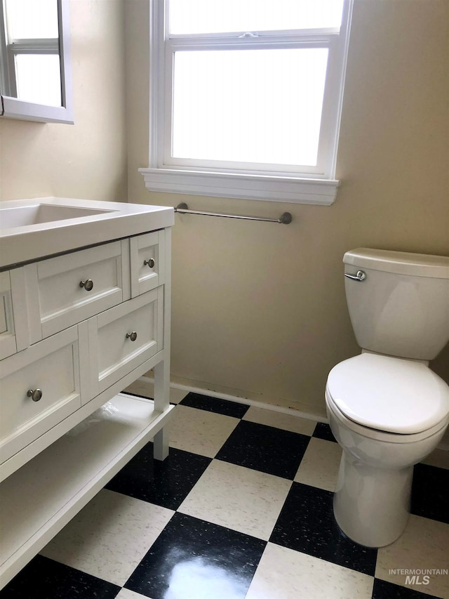 bathroom with vanity and toilet