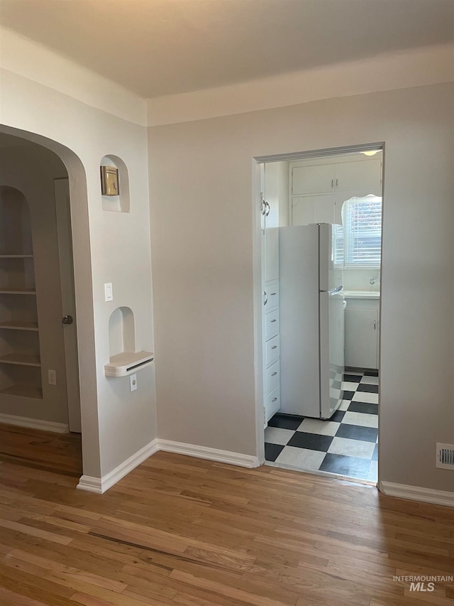 hall featuring hardwood / wood-style flooring