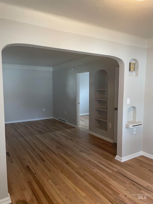 spare room with hardwood / wood-style flooring