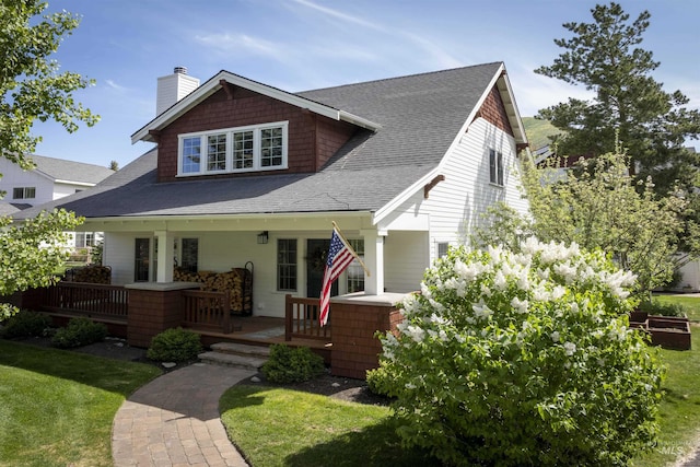 1430 N 2nd Ave, Hailey, ID 83333 - view of front of home featuring a chimney, a front lawn, and a shingled roof
