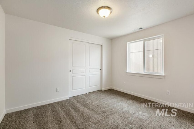 1116 N Peakhurt Ave, Kuna, ID 83634 - unfurnished bedroom featuring carpet floors and a closet