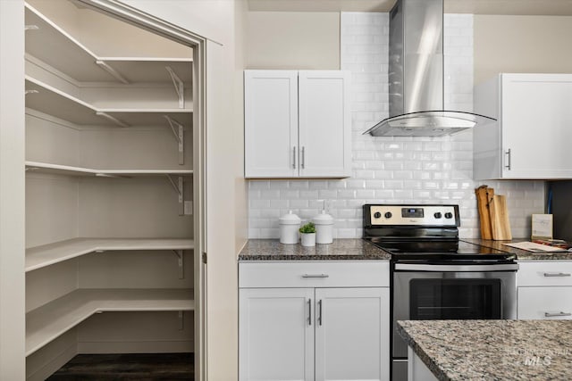 2089 W Claira Rd, Nampa, ID 83651 - kitchen featuring stainless steel electric stove, wall chimney exhaust hood, open shelves, and white cabinets
