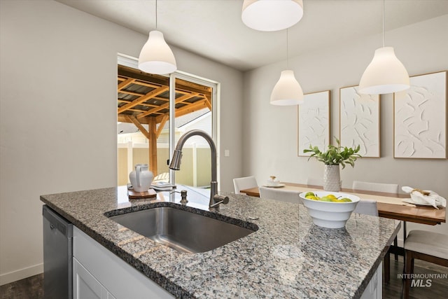 2089 W Claira Rd, Nampa, ID 83651 - kitchen featuring dishwasher, dark wood finished floors, dark stone countertops, and pendant lighting