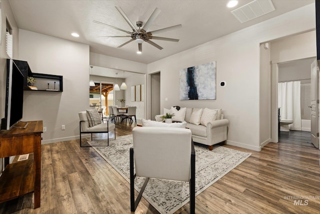 2089 W Claira Rd, Nampa, ID 83651 - living room featuring ceiling fan, wood finished floors, and recessed lighting