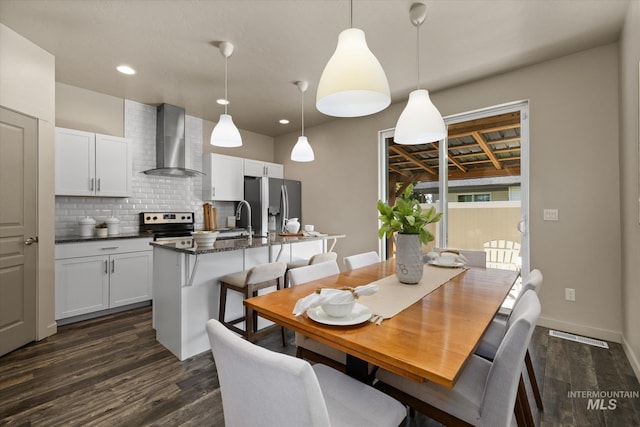 2089 W Claira Rd, Nampa, ID 83651 - dining space with dark wood finished floors and recessed lighting