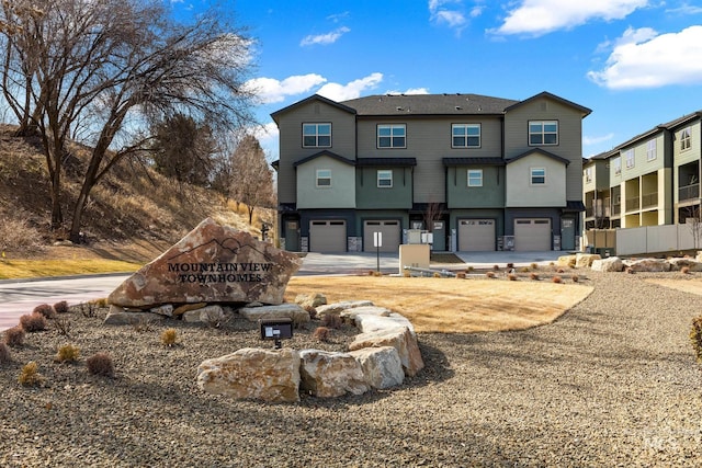 7439 W Swain Ln, Garden City, ID 83714 - back of house with a garage