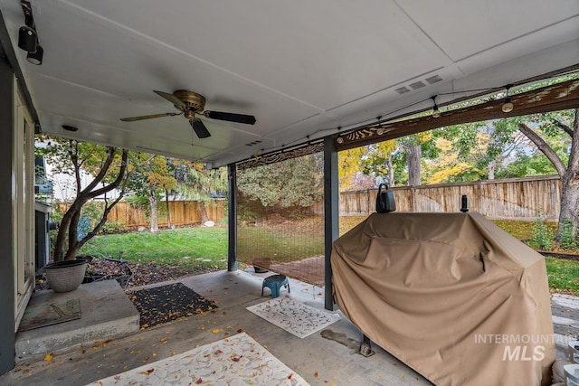 view of patio featuring ceiling fan