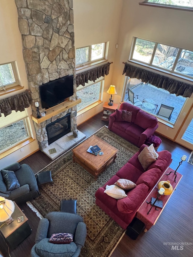1013 Penstemen Pl, Mccall, ID 83638 - living area with a stone fireplace, wood finished floors, and a high ceiling