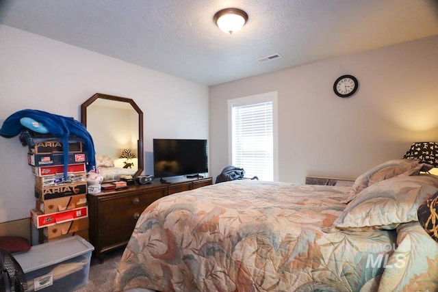 bedroom featuring visible vents