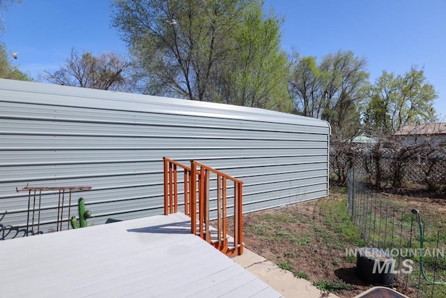 property entrance with a wooden deck