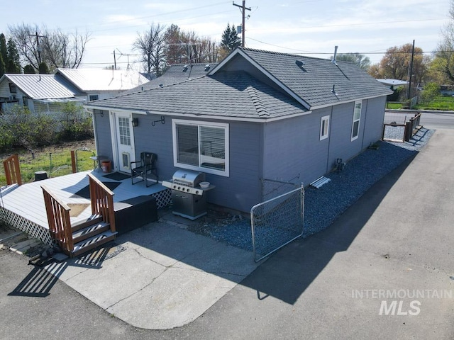 back of property with a deck