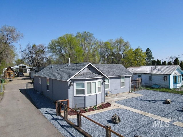 view of front of house featuring fence