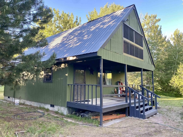 186 Phillips Creek Ln, Fairfield, ID 83327 - view of front of house with metal roof, a porch, and crawl space