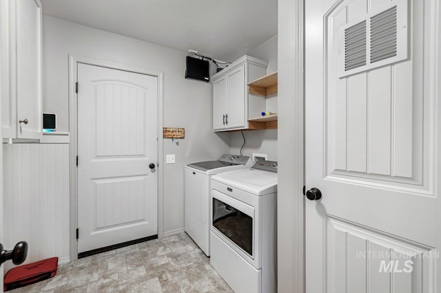 1022 S Date St, Jerome, ID 83338 - laundry area featuring washing machine and clothes dryer and cabinet space