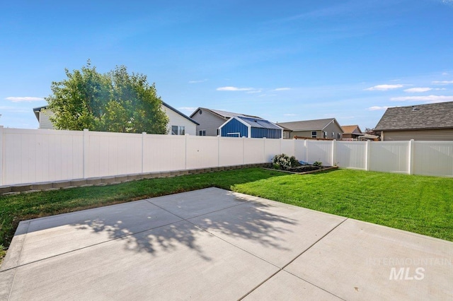1022 S Date St, Jerome, ID 83338 - fenced backyard featuring a patio area and a residential view