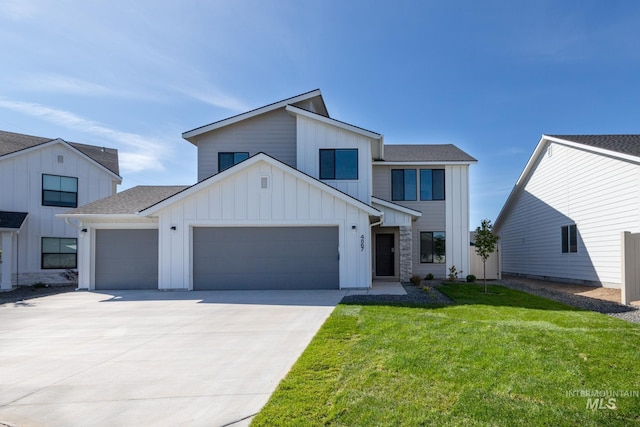 modern farmhouse style home featuring a garage and a front yard