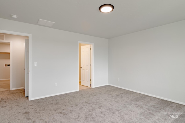 unfurnished bedroom featuring light colored carpet