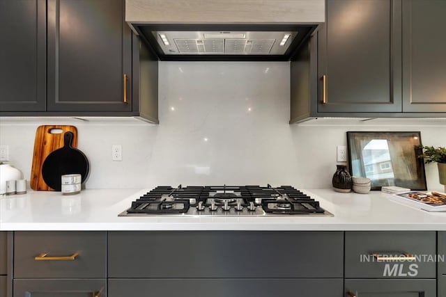 7680 W Old School St, Meridian, ID 83646 - kitchen with stainless steel gas stovetop, ventilation hood, light countertops, and gray cabinets