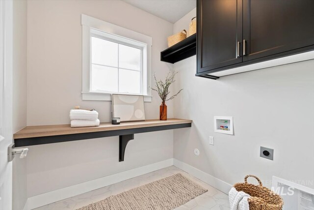 7680 W Old School St, Meridian, ID 83646 - laundry room featuring hookup for an electric dryer, cabinet space, light marble finish floors, hookup for a washing machine, and baseboards