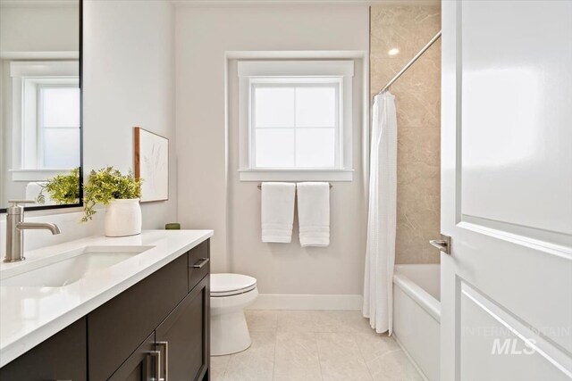 7680 W Old School St, Meridian, ID 83646 - full bathroom with vanity, toilet, shower / bathtub combination with curtain, and baseboards