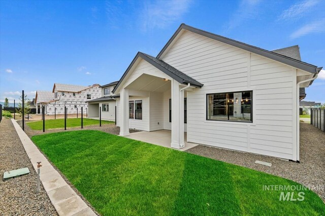 7680 W Old School St, Meridian, ID 83646 - rear view of house with a patio