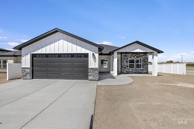 1012 23rd Ave E, Jerome, ID 83338 - modern farmhouse with stone siding, board and batten siding, an attached garage, and concrete driveway
