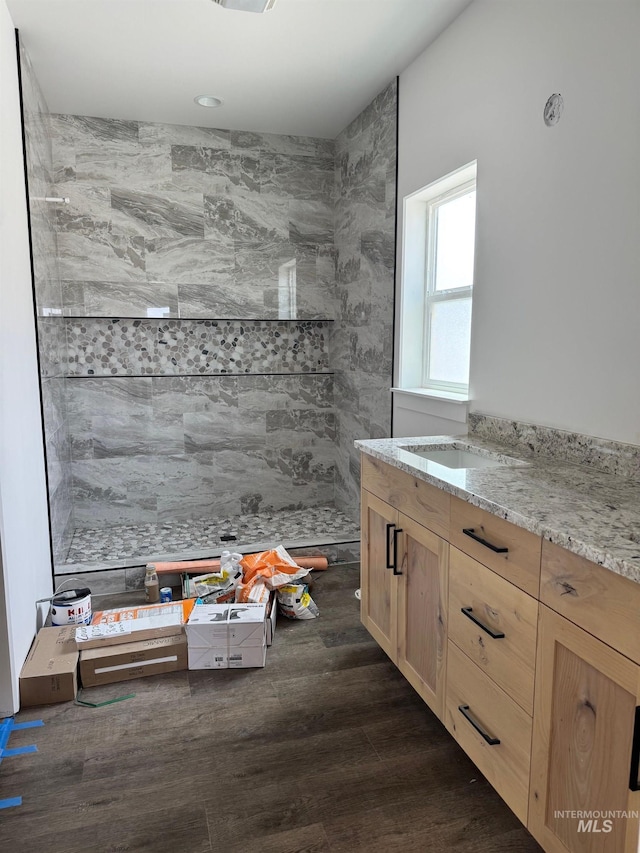 1012 23rd Ave E, Jerome, ID 83338 - bathroom with wood finished floors, tiled shower, and vanity