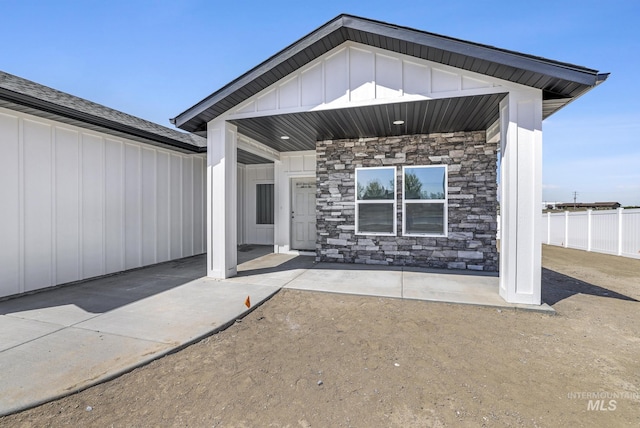 1012 23rd Ave E, Jerome, ID 83338 - doorway to property featuring board and batten siding and stone siding
