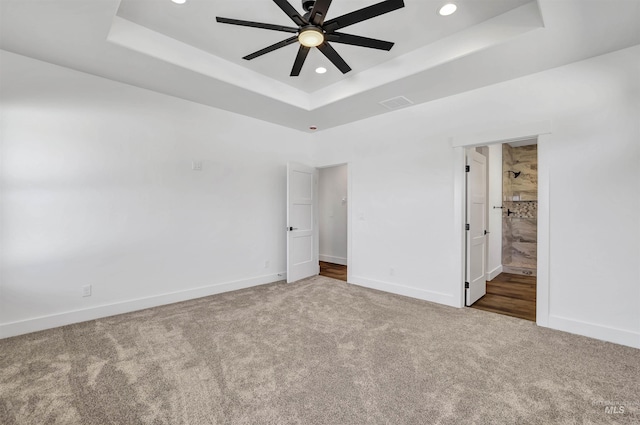 1012 23rd Ave E, Jerome, ID 83338 - unfurnished bedroom with carpet, a raised ceiling, recessed lighting, baseboards, and ensuite bath