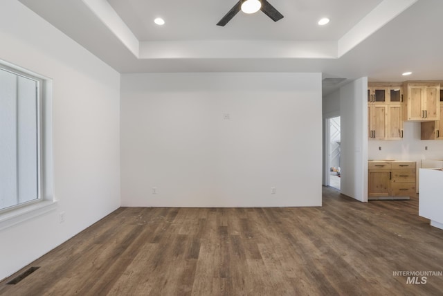 1012 23rd Ave E, Jerome, ID 83338 - unfurnished living room with recessed lighting, a raised ceiling, dark wood-style flooring, and ceiling fan