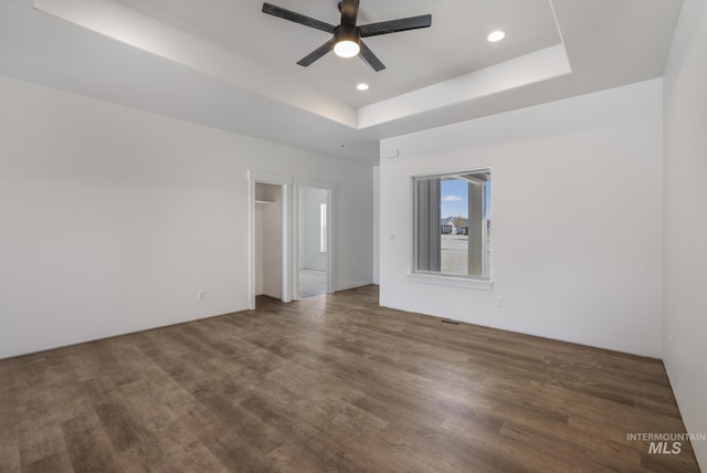 1012 23rd Ave E, Jerome, ID 83338 - spare room with recessed lighting, a ceiling fan, wood finished floors, and a tray ceiling