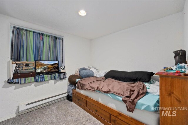 722 Nevada St, Gooding, ID 83330 - bedroom featuring a baseboard radiator and carpet floors