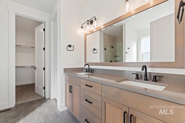 bathroom featuring vanity and an enclosed shower