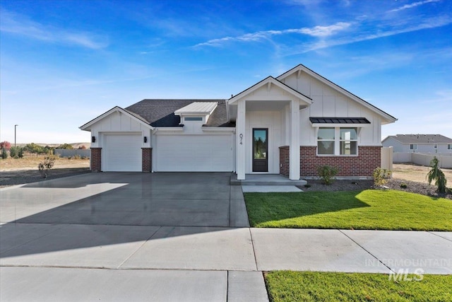 view of front facade with a garage and a front lawn