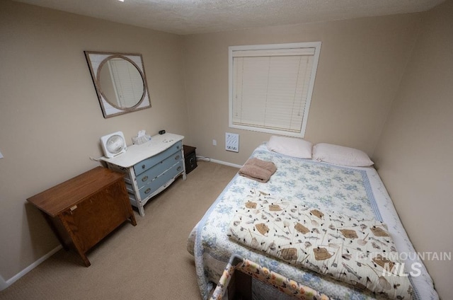 carpeted bedroom with a textured ceiling