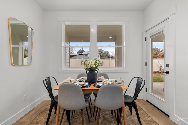 dining area with light hardwood / wood-style floors