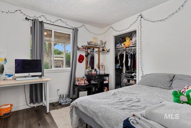 107 Nogales, Caldwell, ID 83605 - bedroom with a textured ceiling, wood finished floors, a closet, and baseboards