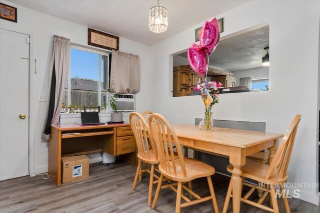 107 Nogales, Caldwell, ID 83605 - dining room with wood finished floors, a desk, a chandelier, and cooling unit