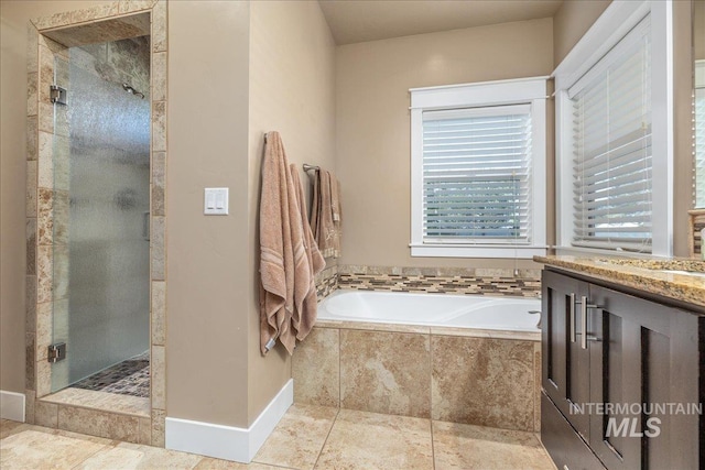 full bathroom with a shower stall and a bath