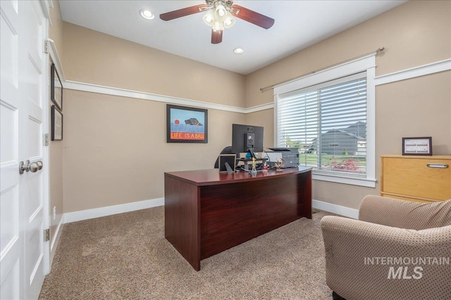 carpeted office space with a ceiling fan, baseboards, and recessed lighting