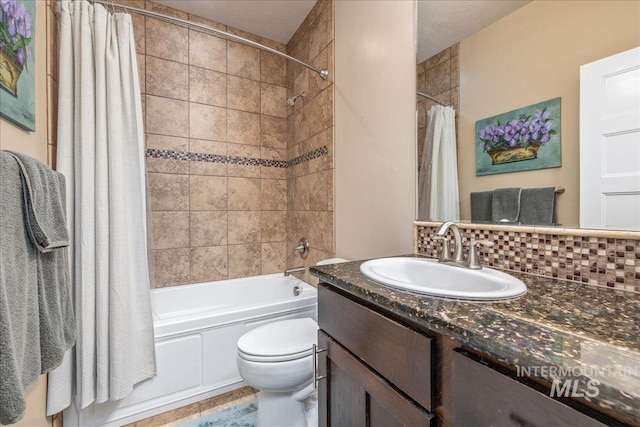 full bath featuring vanity, backsplash, toilet, and shower / tub combo