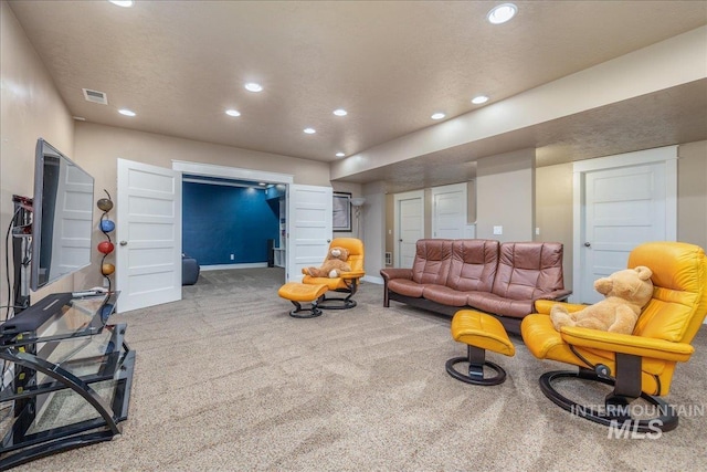 living area with recessed lighting, baseboards, carpet floors, and visible vents