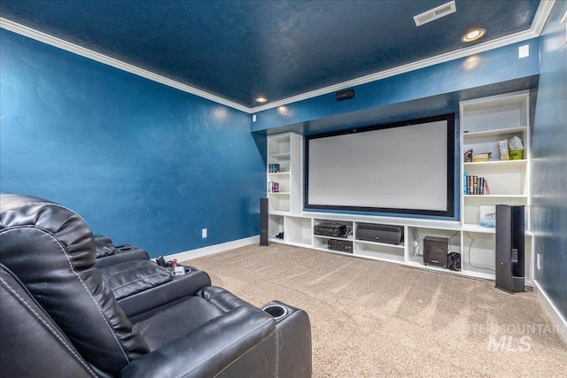home theater featuring baseboards, ornamental molding, carpet flooring, and visible vents