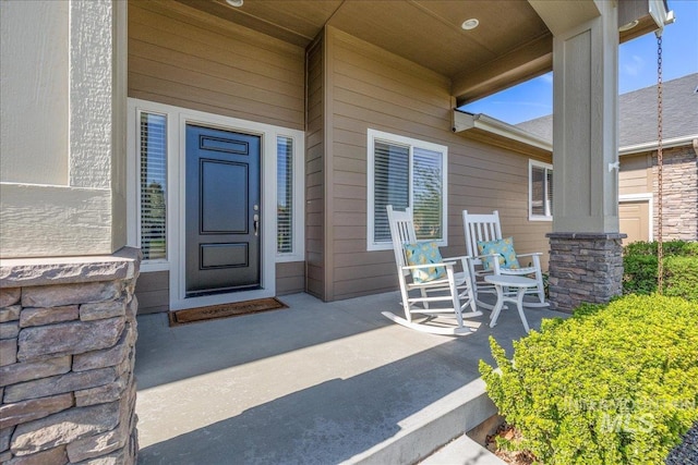 doorway to property featuring stone siding