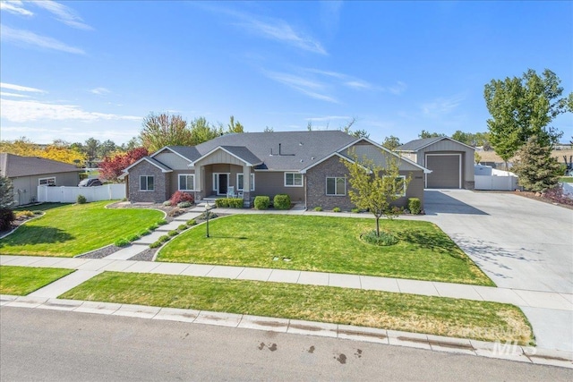 ranch-style home with fence, driveway, a front lawn, and a garage
