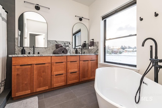 1047 Kaitlyn Loop, Mccall, ID 83638 - full bath featuring double vanity, backsplash, and tile patterned floors