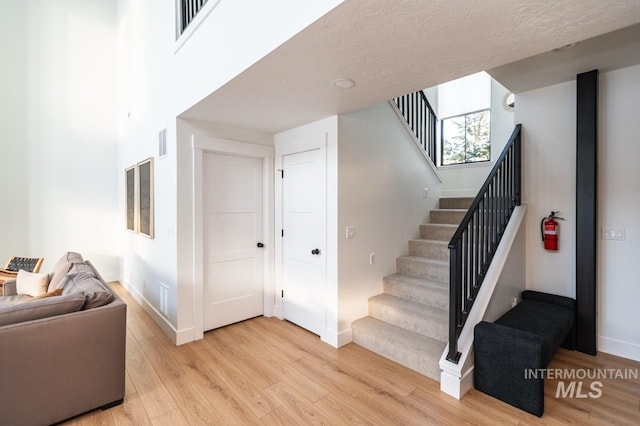 1047 Kaitlyn Loop, Mccall, ID 83638 - staircase featuring wood finished floors and baseboards