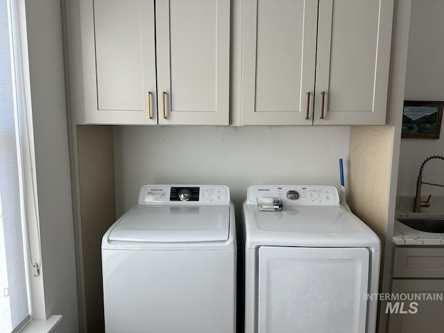 1047 Kaitlyn Loop, Mccall, ID 83638 - laundry room featuring cabinet space and separate washer and dryer