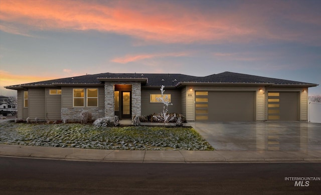 prairie-style home featuring a garage